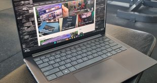 Lenovo Yoga Pro 7i Aura Edition Gen 10 sitting open on a gym bench with The Empire NZ website landing page open